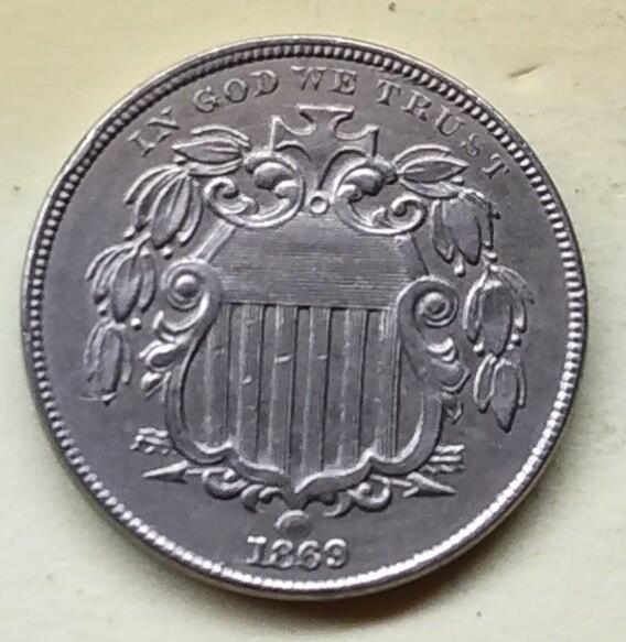 Shield-Nickel-1869---Rim-Dents---Die-Break